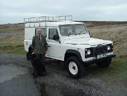 Alex Waterman and Holly the dog - seen with their new - 1994 Land Rover Defender 110 Tdi - 3 door - on Marsden MOor West Yorkshire